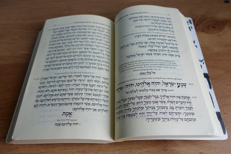 A Hebrew prayer book open to the pages of Kriat Sh'ma